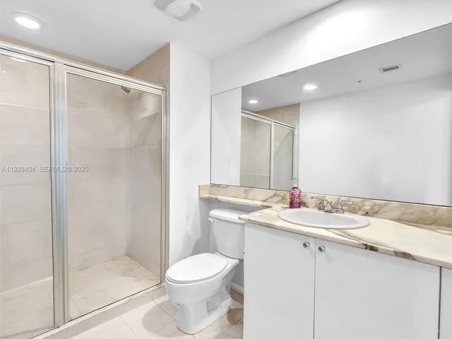 a very nice looking room with a large window and chandelier