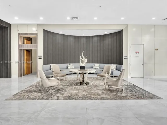 a view of a hallway with seating area