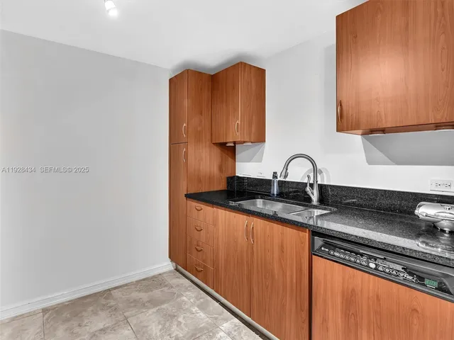 a kitchen with stainless steel appliances granite countertop a stove and a sink