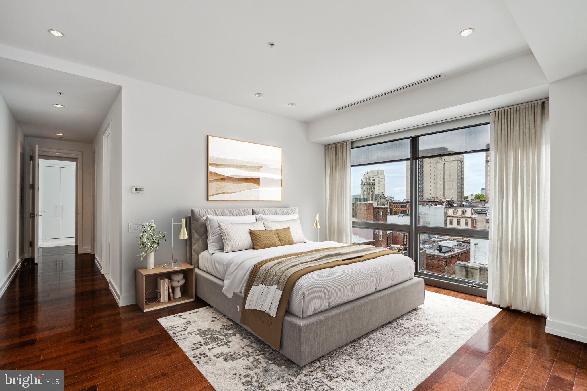 1706 Rittenhouse Square, Unit 402 Philadelphia, PA 19103 - Photo 11 of 27 a bedroom with a large bed and a window