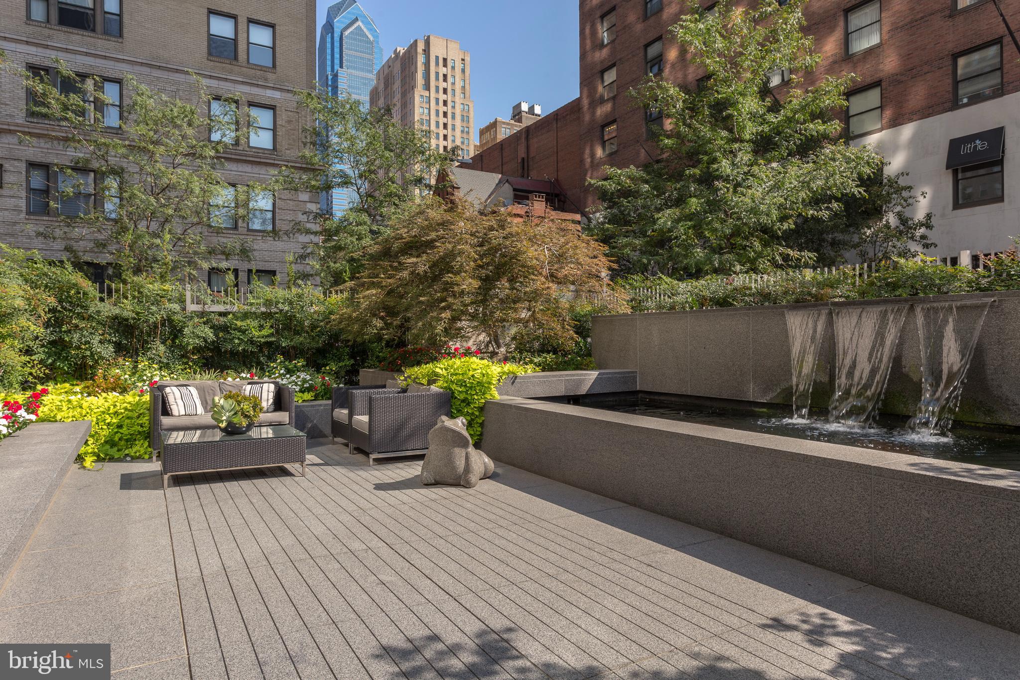 1706 Rittenhouse Square, Unit 402 Philadelphia, PA 19103 - Photo 25 of 27 a swimming pool with outdoor seating and plants