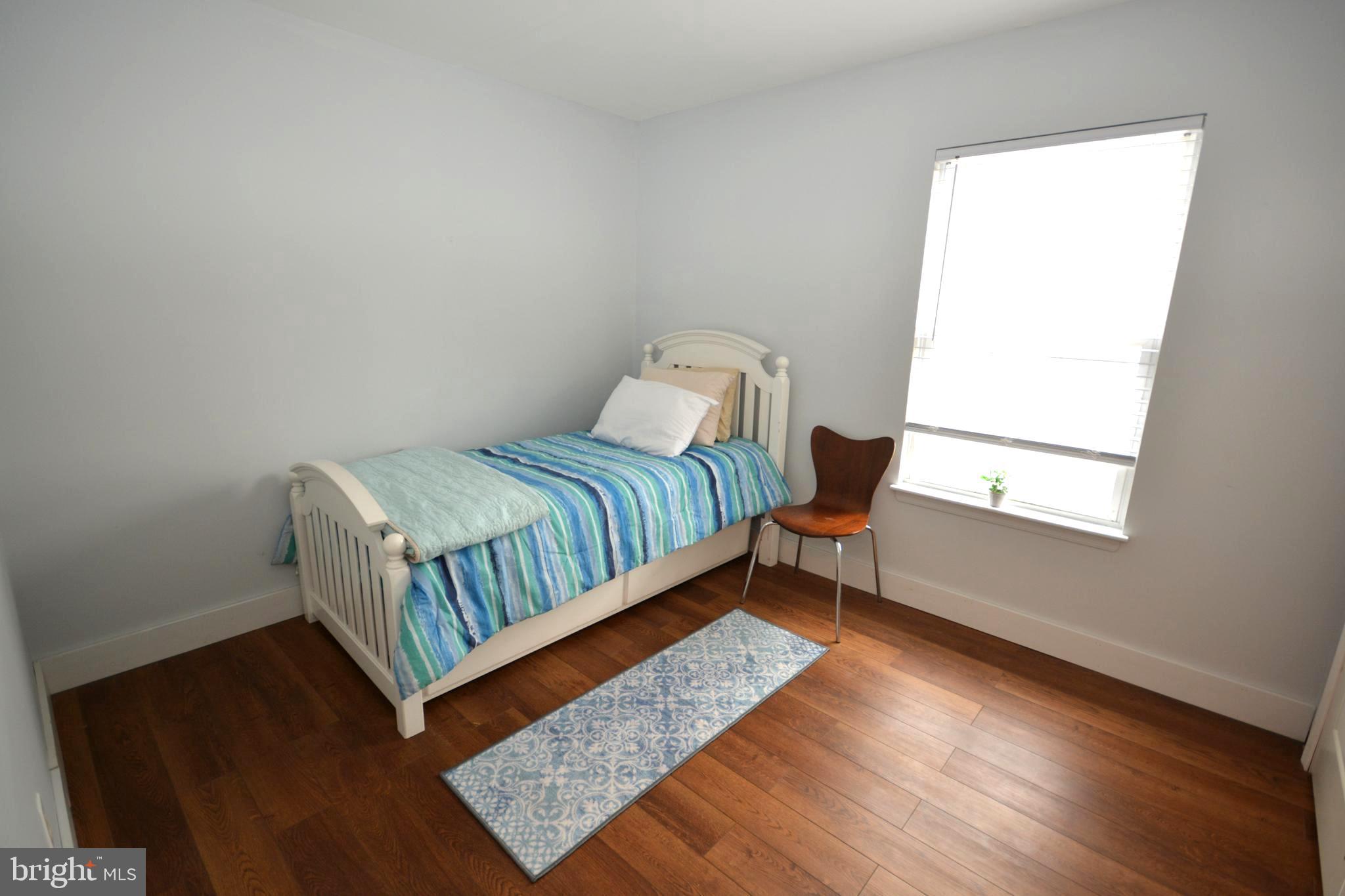 106 B Conner Street St. Michaels, MD 21663 - Photo 11 of 27 a bedroom with a bed and window