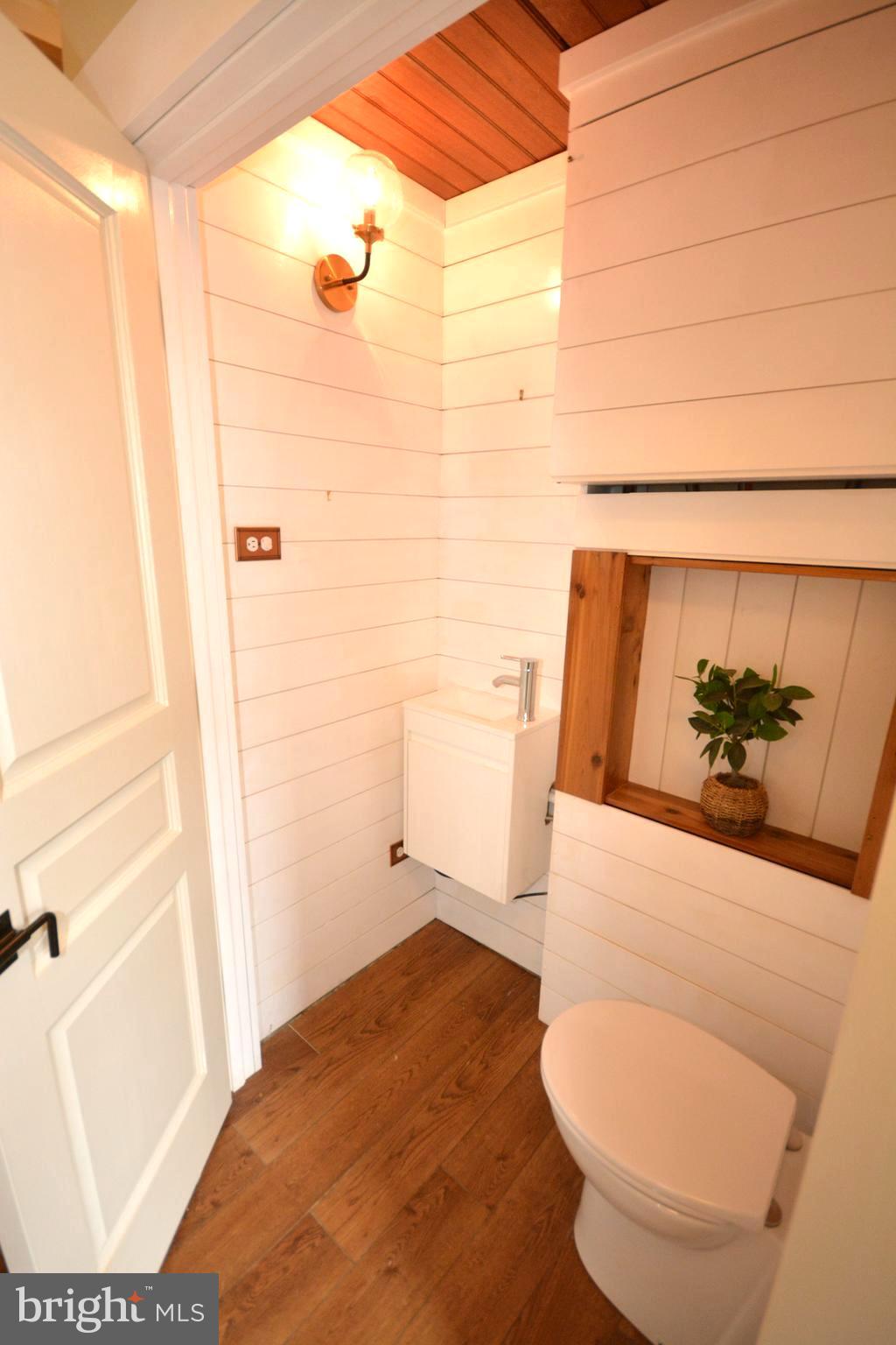 106 B Conner Street St. Michaels, MD 21663 - Photo 15 of 27 a bathroom with a toilet and a shower