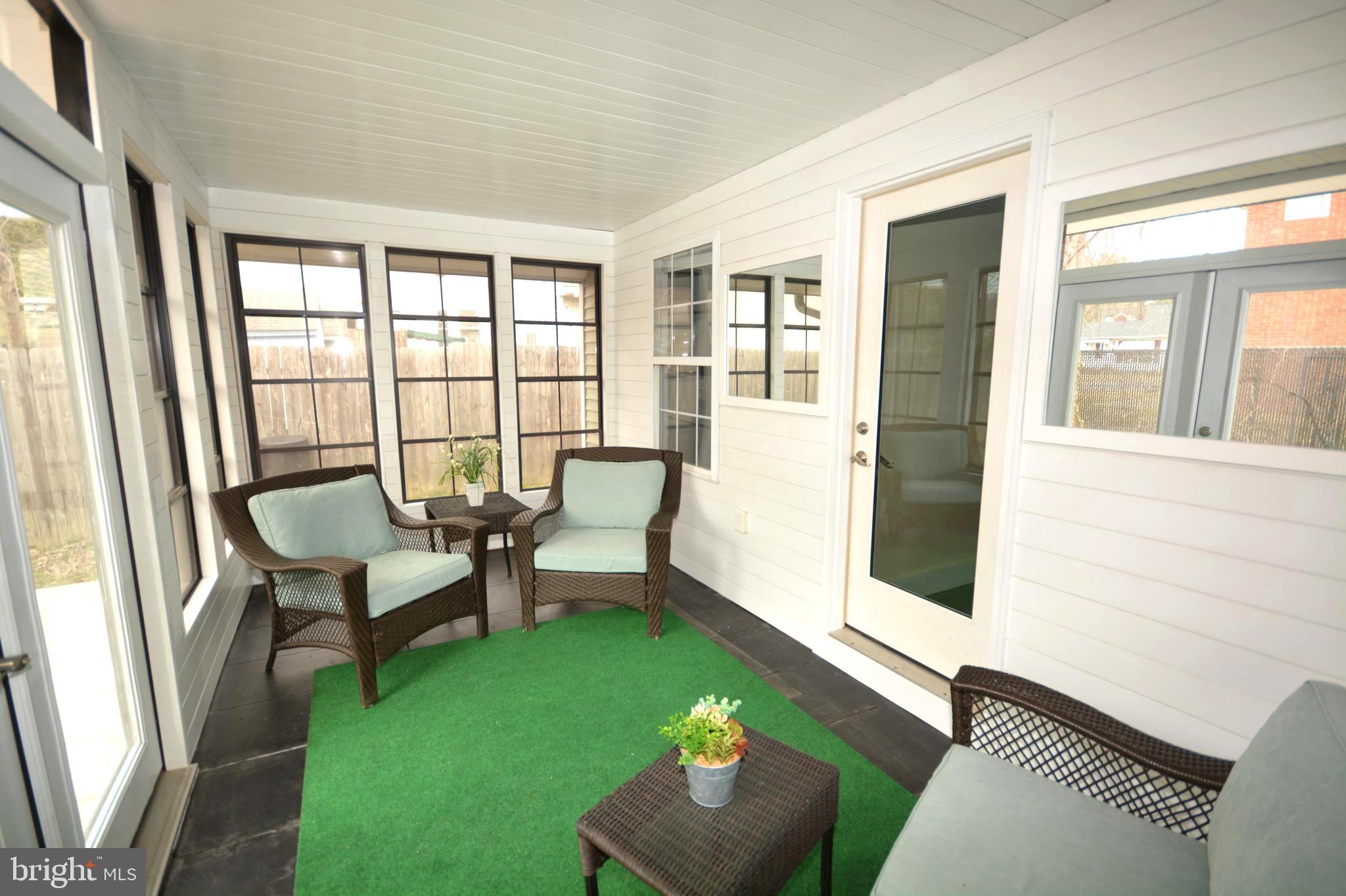 106 B Conner Street St. Michaels, MD 21663 - Photo 21 of 27 a living room with furniture and a window