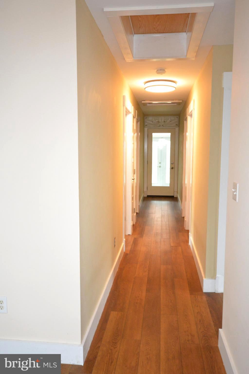 106 B Conner Street St. Michaels, MD 21663 - Photo 22 of 27 a view of a hallway with wooden floor