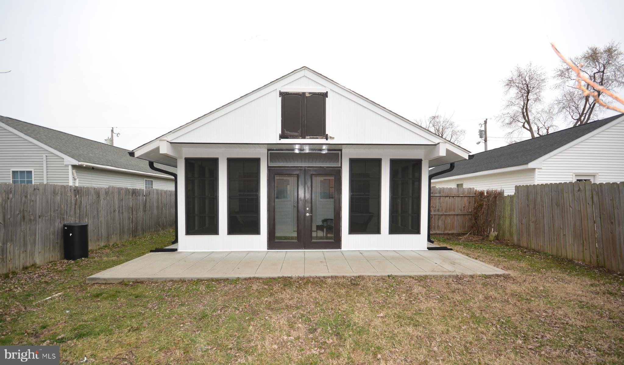 106 B Conner Street St. Michaels, MD 21663 - Photo 5 of 27 a front view of a house with a garage