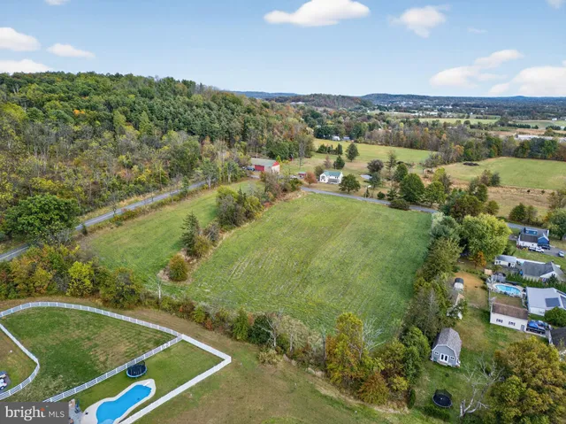 a view of a lake with houses in the background