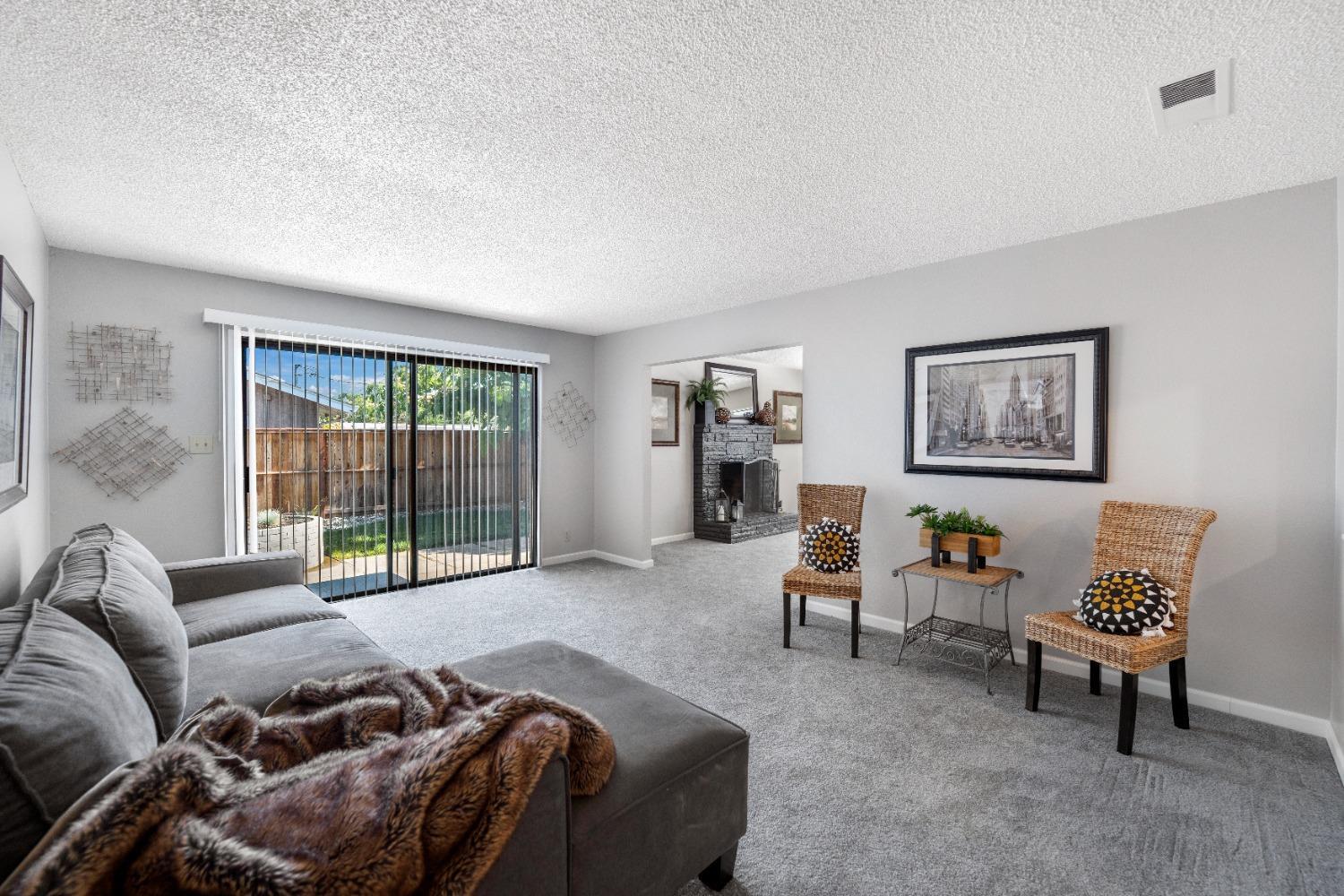 2727 Buttonwillow Avenue Stockton, CA 95207 - Photo 1 of 1 a bed room with a bed and a couch