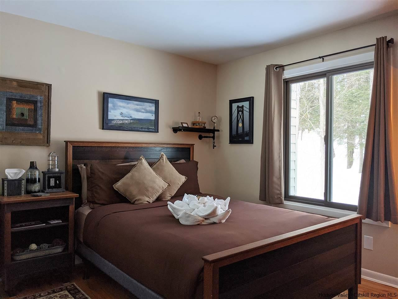 430 North Riverside Road Highland, NY 12528 - Photo 11 of 34 a bedroom with a bed and dresser