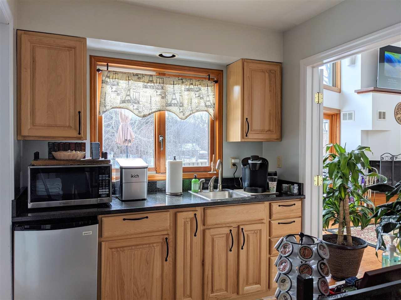 430 North Riverside Road Highland, NY 12528 - Photo 13 of 34 a kitchen with stainless steel appliances granite countertop a stove a sink and a microwave