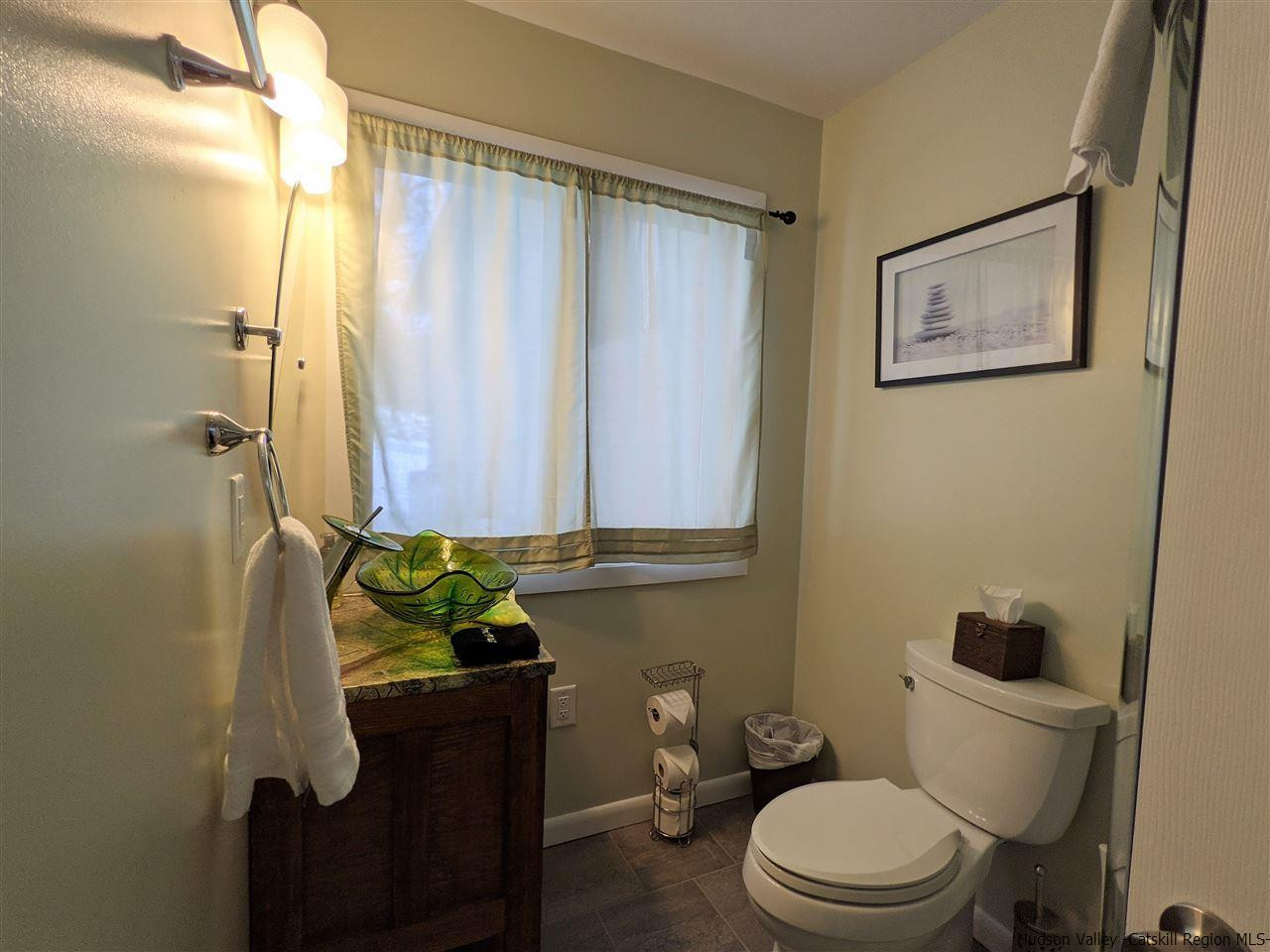 430 North Riverside Road Highland, NY 12528 - Photo 16 of 34 a bathroom with a toilet a sink and a shower