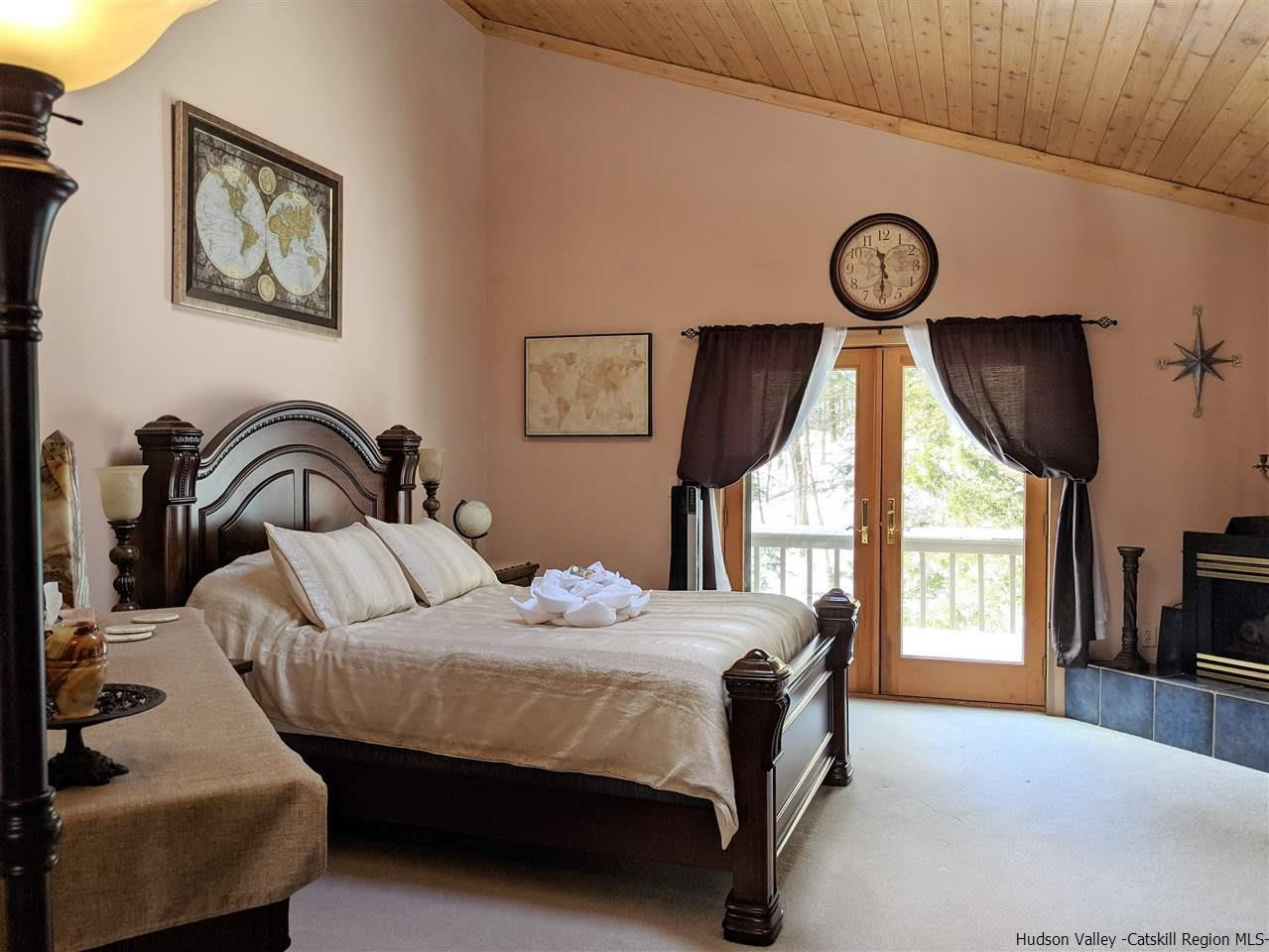 430 North Riverside Road Highland, NY 12528 - Photo 28 of 34 a bedroom with a bed and a large window