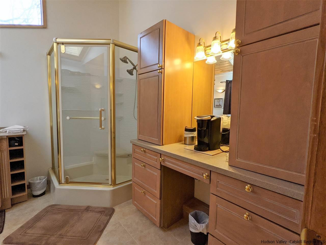 430 North Riverside Road Highland, NY 12528 - Photo 30 of 34 a bathroom with a shower a sink and a mirror