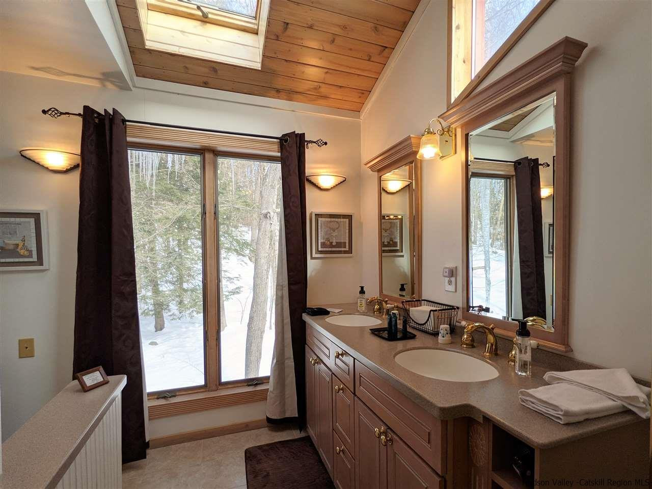 430 North Riverside Road Highland, NY 12528 - Photo 31 of 34 a bathroom with a double vanity sink and a large mirror