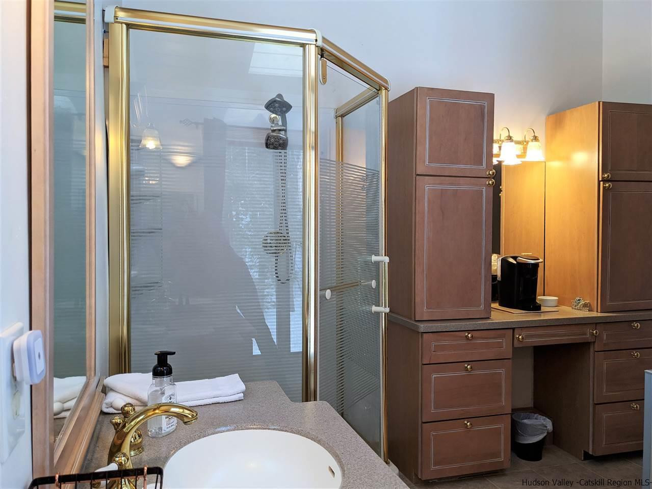 430 North Riverside Road Highland, NY 12528 - Photo 32 of 34 a bathroom with a sink a toilet and shower