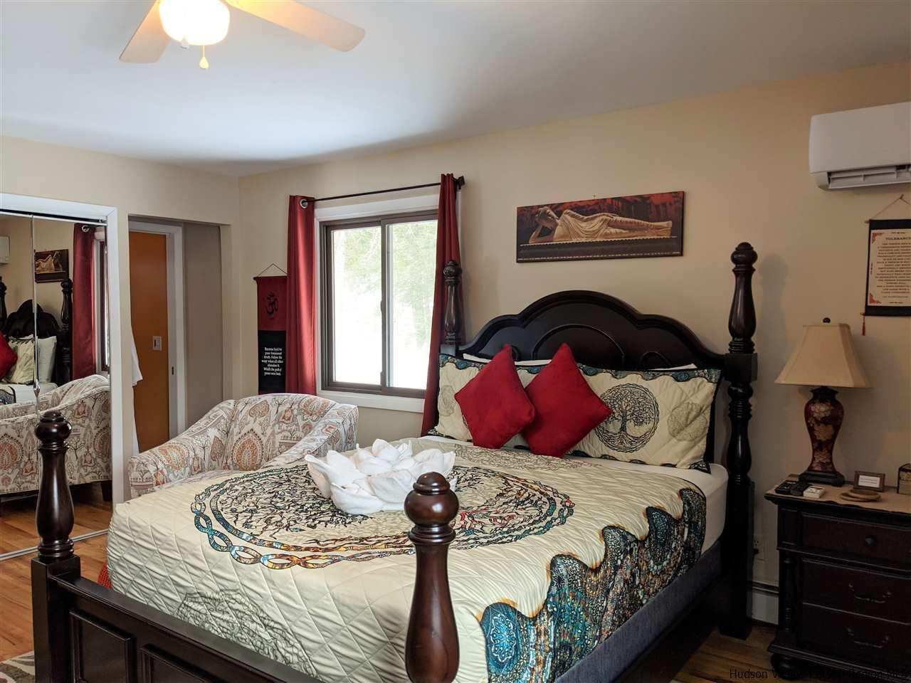 430 North Riverside Road Highland, NY 12528 - Photo 9 of 34 a bedroom with a bed and a dresser