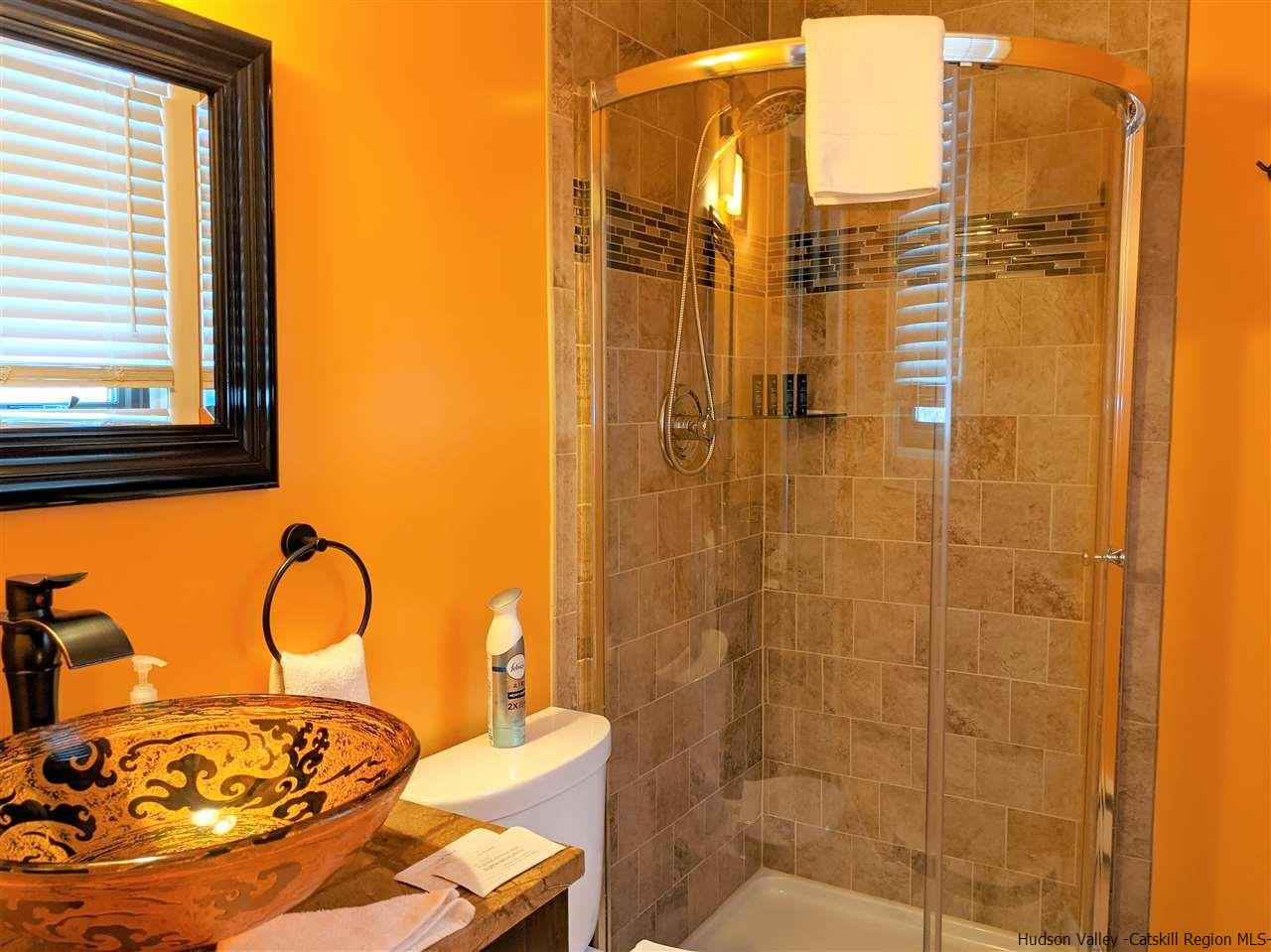 430 North Riverside Road Highland, NY 12528 - Photo 10 of 34 a bathroom with a sink and a shower