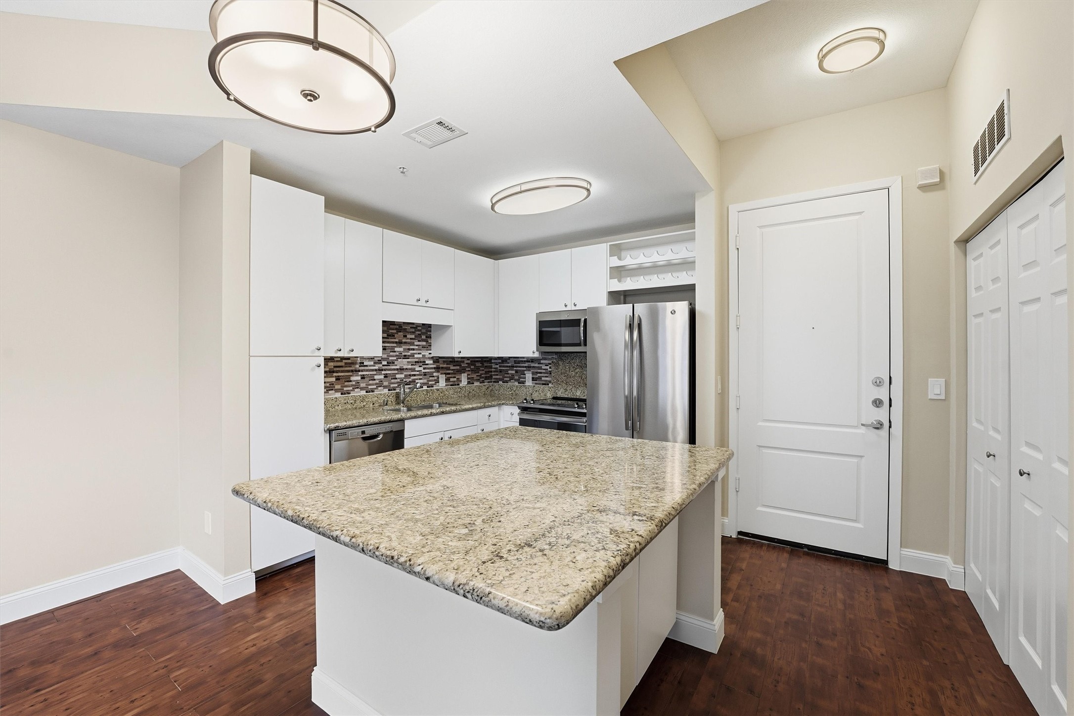 3505 Sage Road, Unit 208 Houston, TX 77056 - Photo 3 of 25 a kitchen with stainless steel appliances granite countertop a sink refrigerator and cabinets