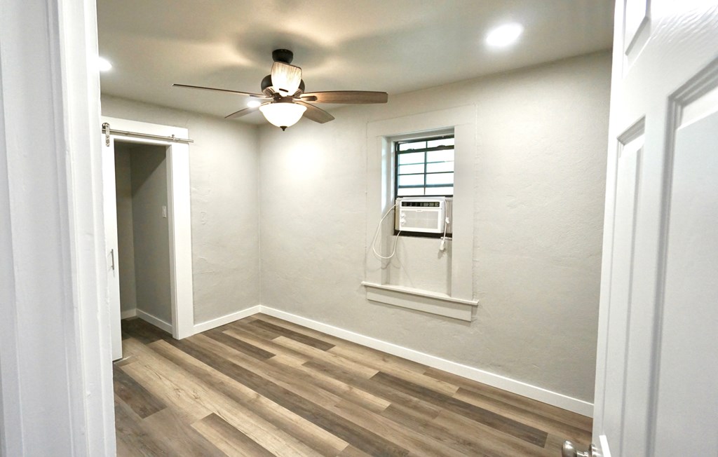 110 4th Street Ingram, TX 78025 - Photo 12 of 15 a view of a livingroom with a white ceiling fan
