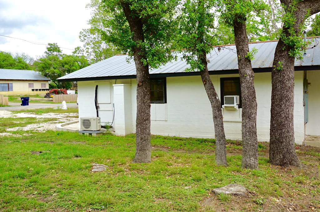 110 4th Street Ingram, TX 78025 - Photo 13 of 15 a backyard of a house with table and chairs