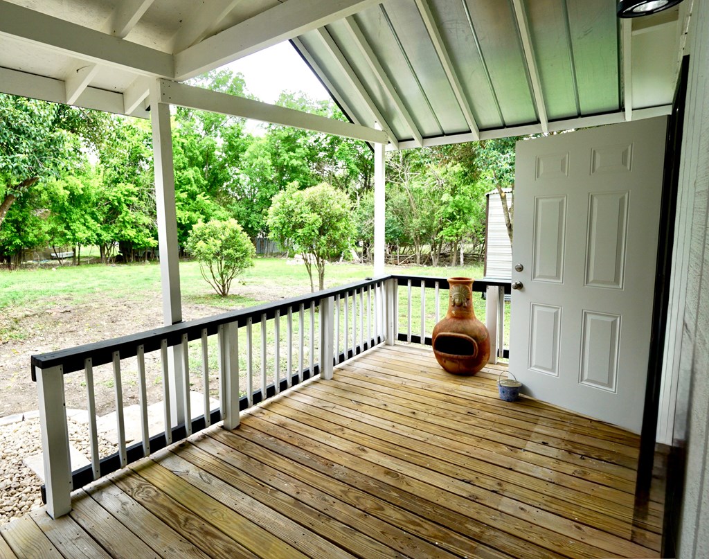 110 4th Street Ingram, TX 78025 - Photo 4 of 15 a view of a balcony with wooden floor