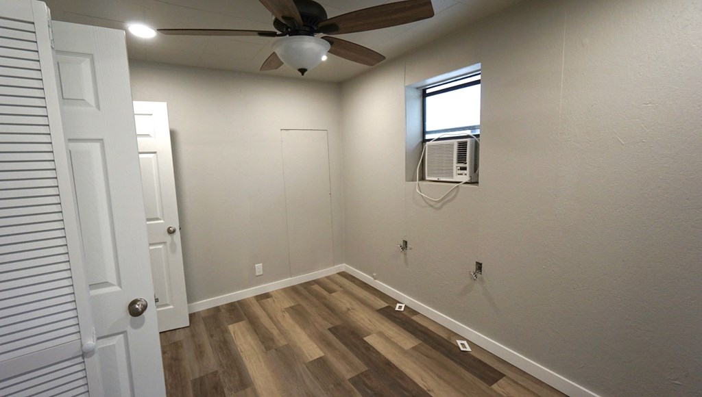 110 4th Street Ingram, TX 78025 - Photo 9 of 15 an empty room with windows and fan
