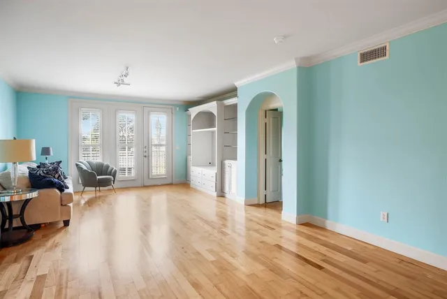 a view of a livingroom with furniture and hardwood floor