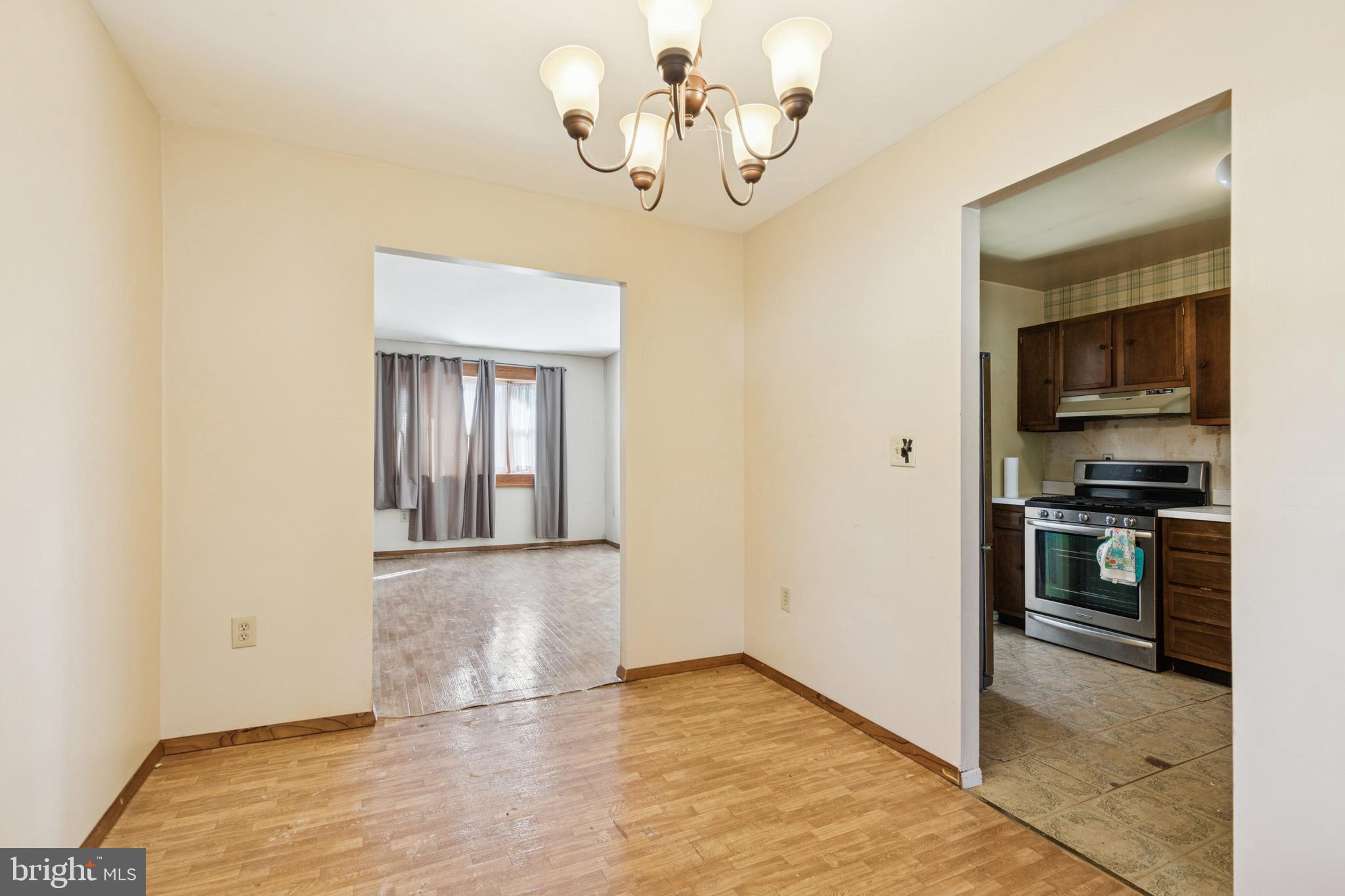 7518 Harmans Road Harmans, MD 21077 - Photo 13 of 34 a view of empty room with kitchen and window