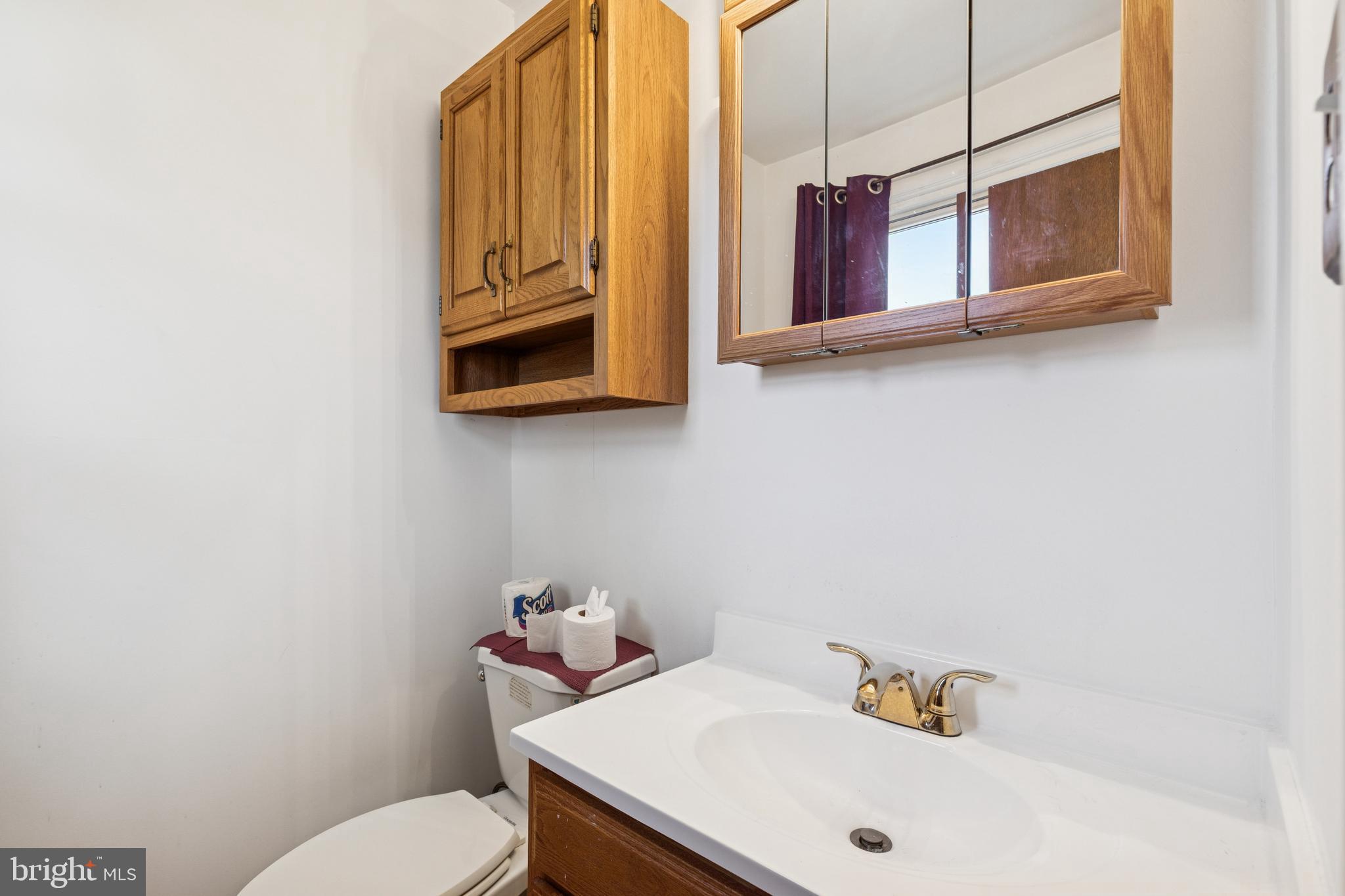 7518 Harmans Road Harmans, MD 21077 - Photo 18 of 34 a bathroom with a sink and a mirror