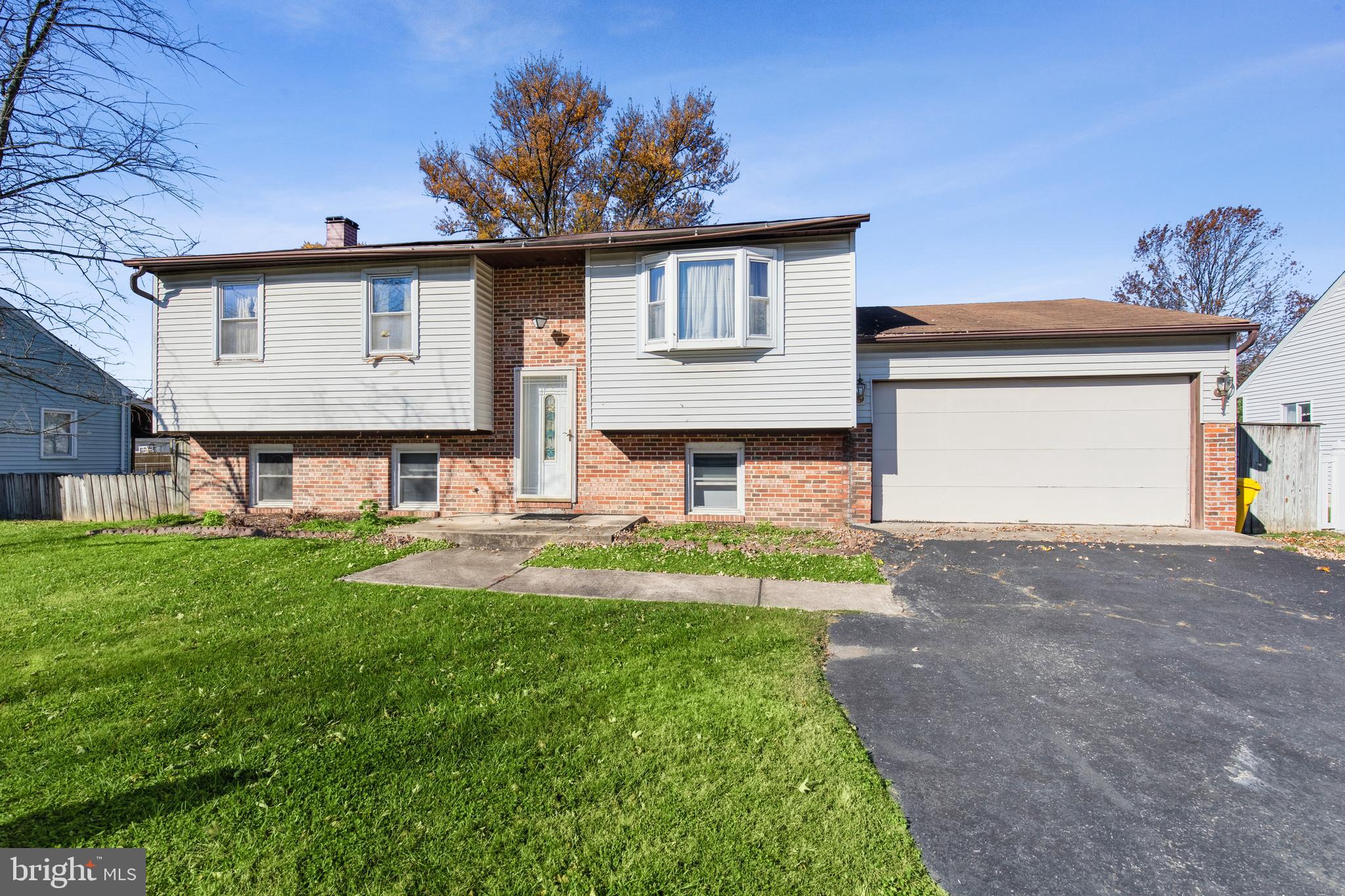 7518 Harmans Road Harmans, MD 21077 - Photo 32 of 34 a front view of a house with garden