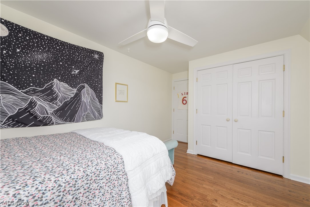 2447 Covington Road Akron, OH 44313 - Photo 29 of 46 Bedroom featuring ceiling fan, hardwood flooring, and large closet