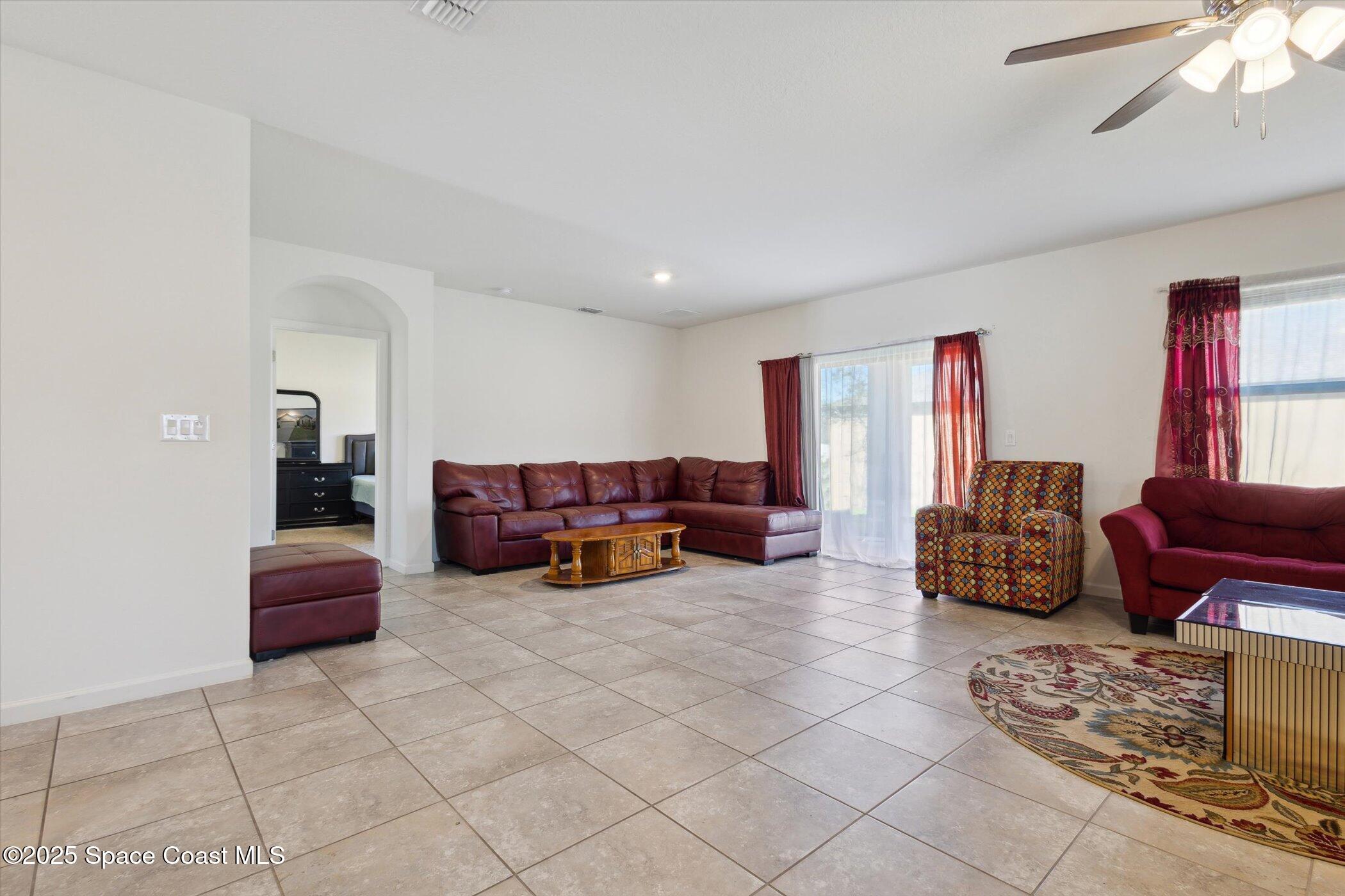 560 Lumber Jack Place Cocoa, FL 32927 - Photo 10 of 32 a living room with furniture and a couch