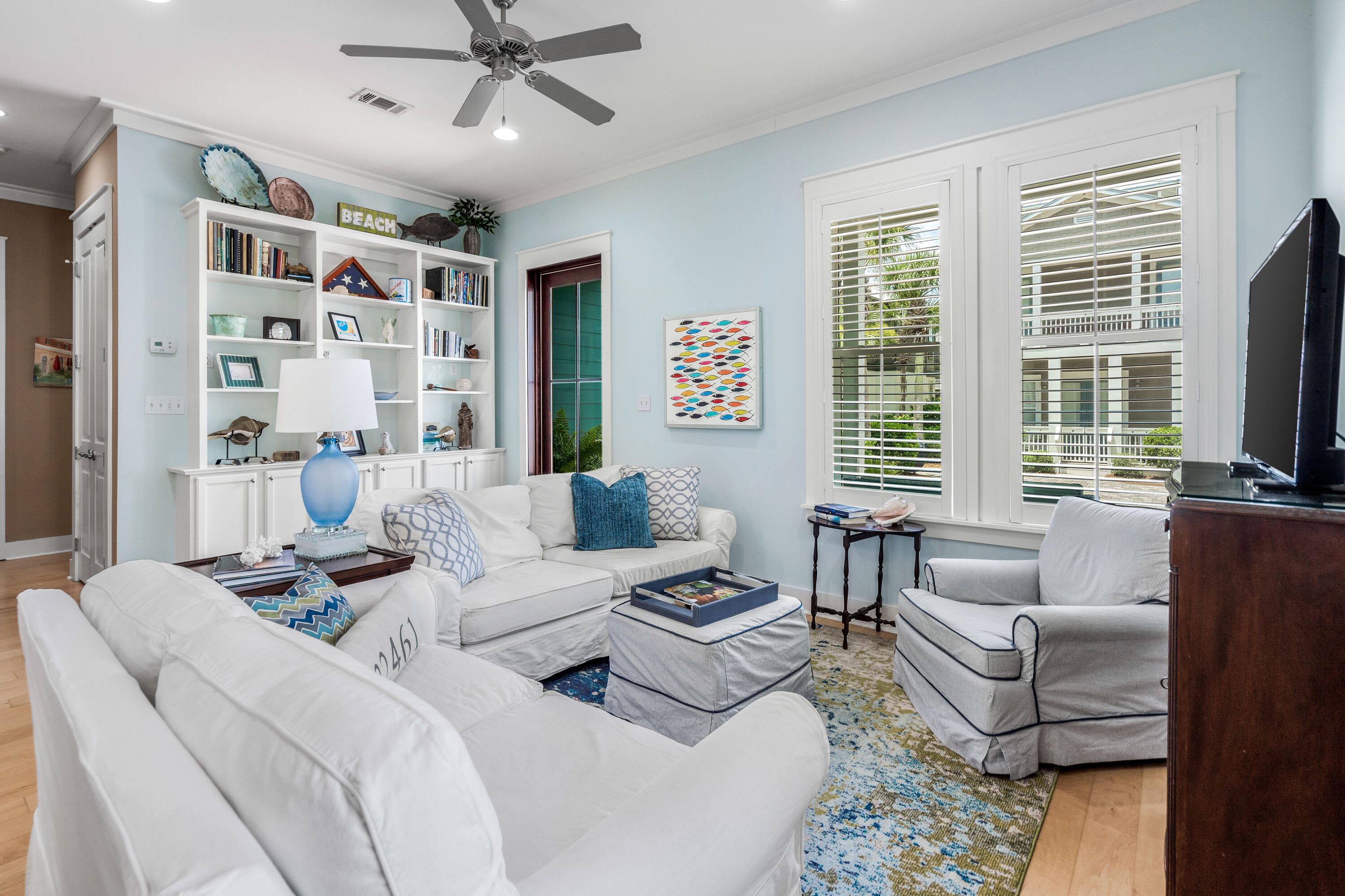 36 Moonlight Beach Lane Inlet Beach, FL 32461 - Photo 13 of 42 a living room with furniture a flat screen tv and a large window
