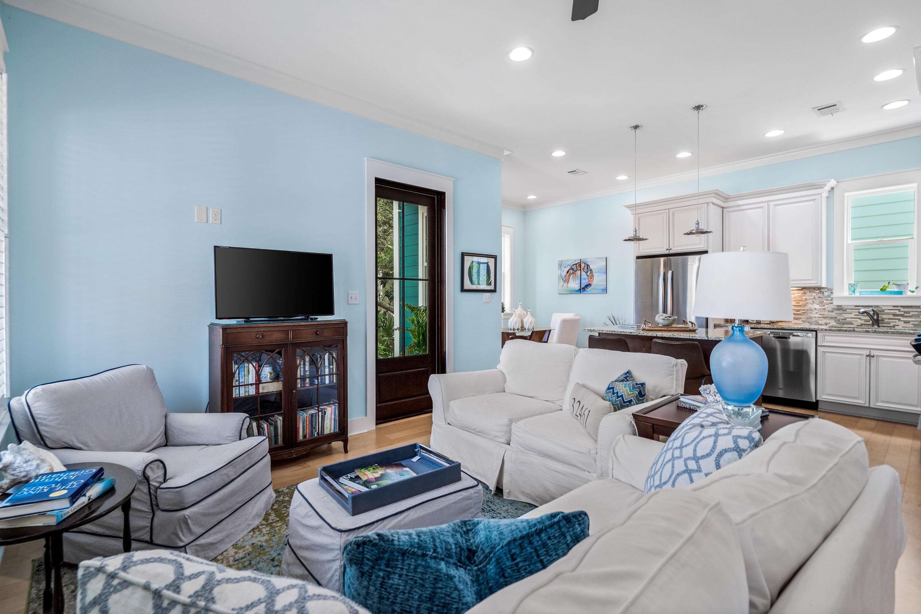 36 Moonlight Beach Lane Inlet Beach, FL 32461 - Photo 15 of 42 a living room with furniture a flat screen tv and a fireplace