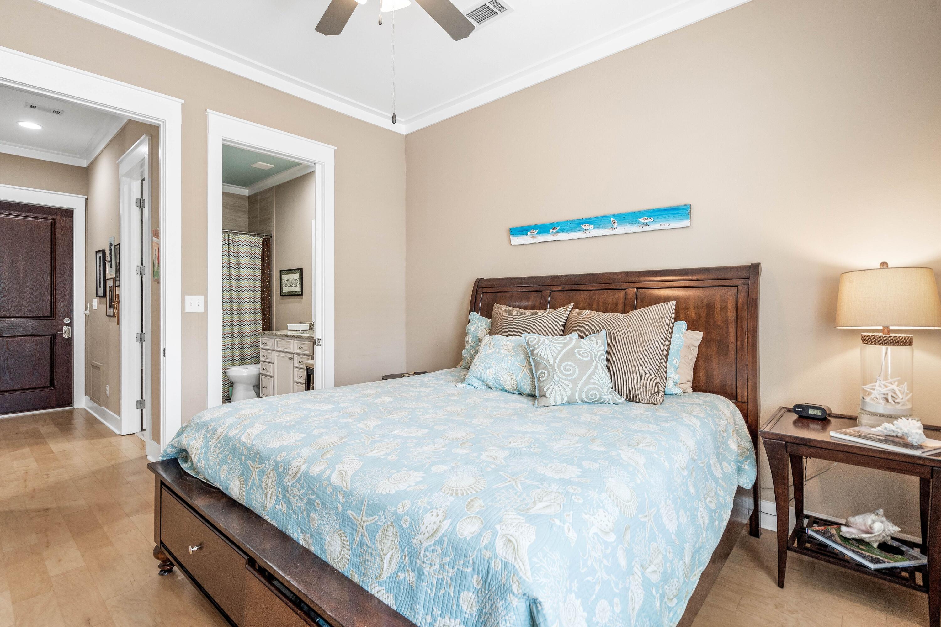 36 Moonlight Beach Lane Inlet Beach, FL 32461 - Photo 17 of 42 a bedroom with a bed and lamp