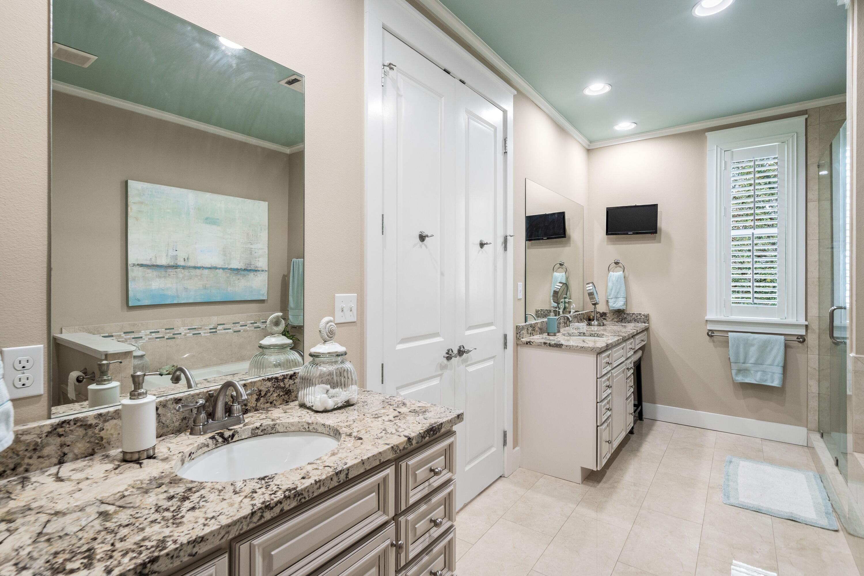 36 Moonlight Beach Lane Inlet Beach, FL 32461 - Photo 25 of 42 a bathroom with a granite countertop double vanity sink and mirror