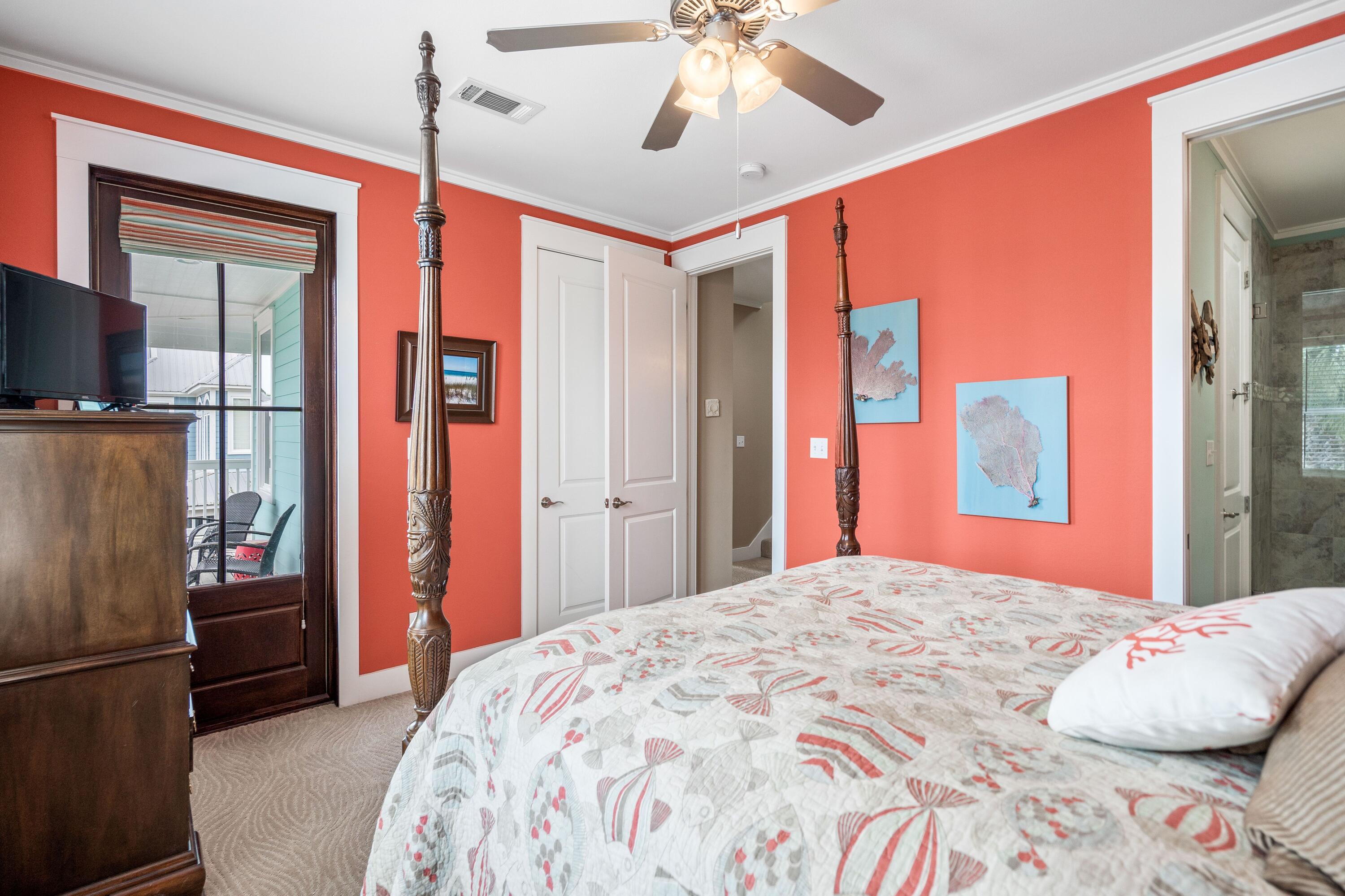 36 Moonlight Beach Lane Inlet Beach, FL 32461 - Photo 30 of 42 a bedroom with a large bed and a chandelier