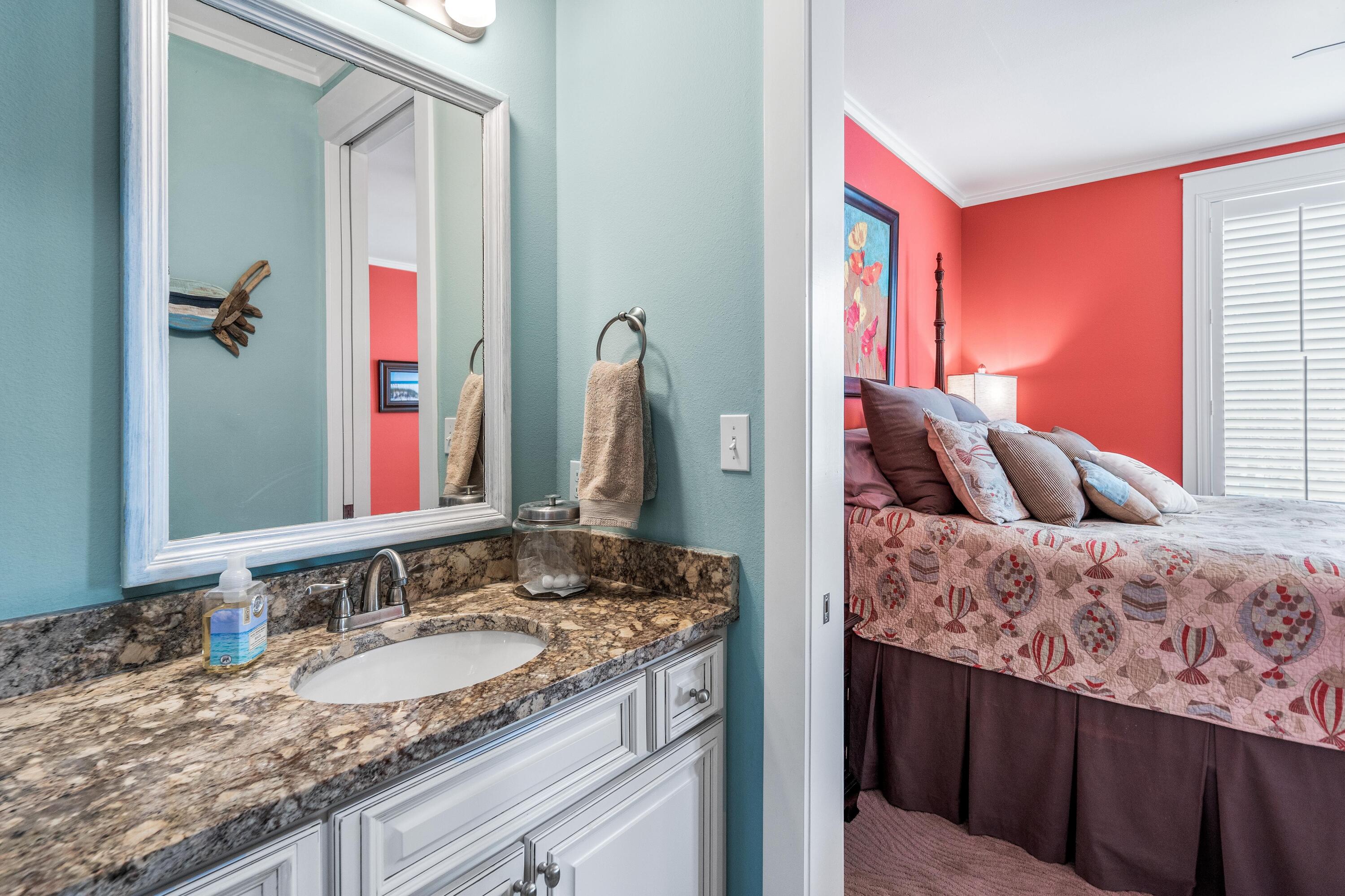 36 Moonlight Beach Lane Inlet Beach, FL 32461 - Photo 35 of 42 a en suite bathroom with a granite countertop sink and a mirror
