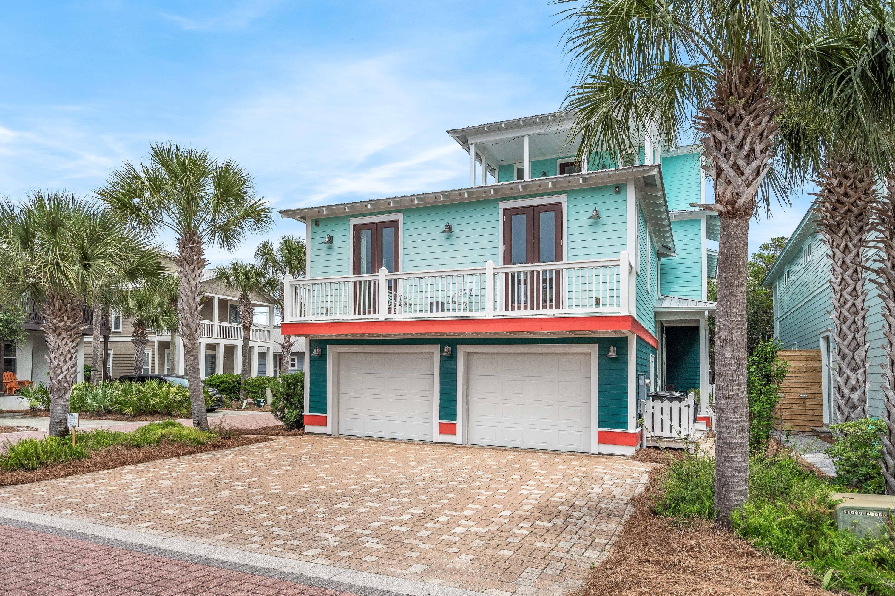 36 Moonlight Beach Lane Inlet Beach, FL 32461 - Photo 6 of 42 a view of a house with a yard and palm trees