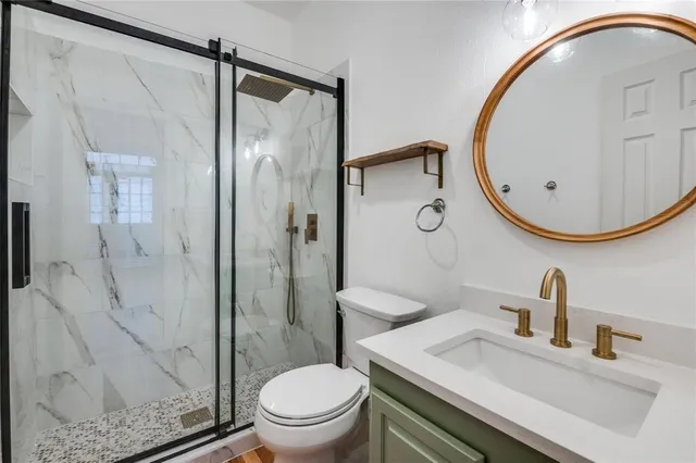 a kitchen with a stove a sink and a microwave