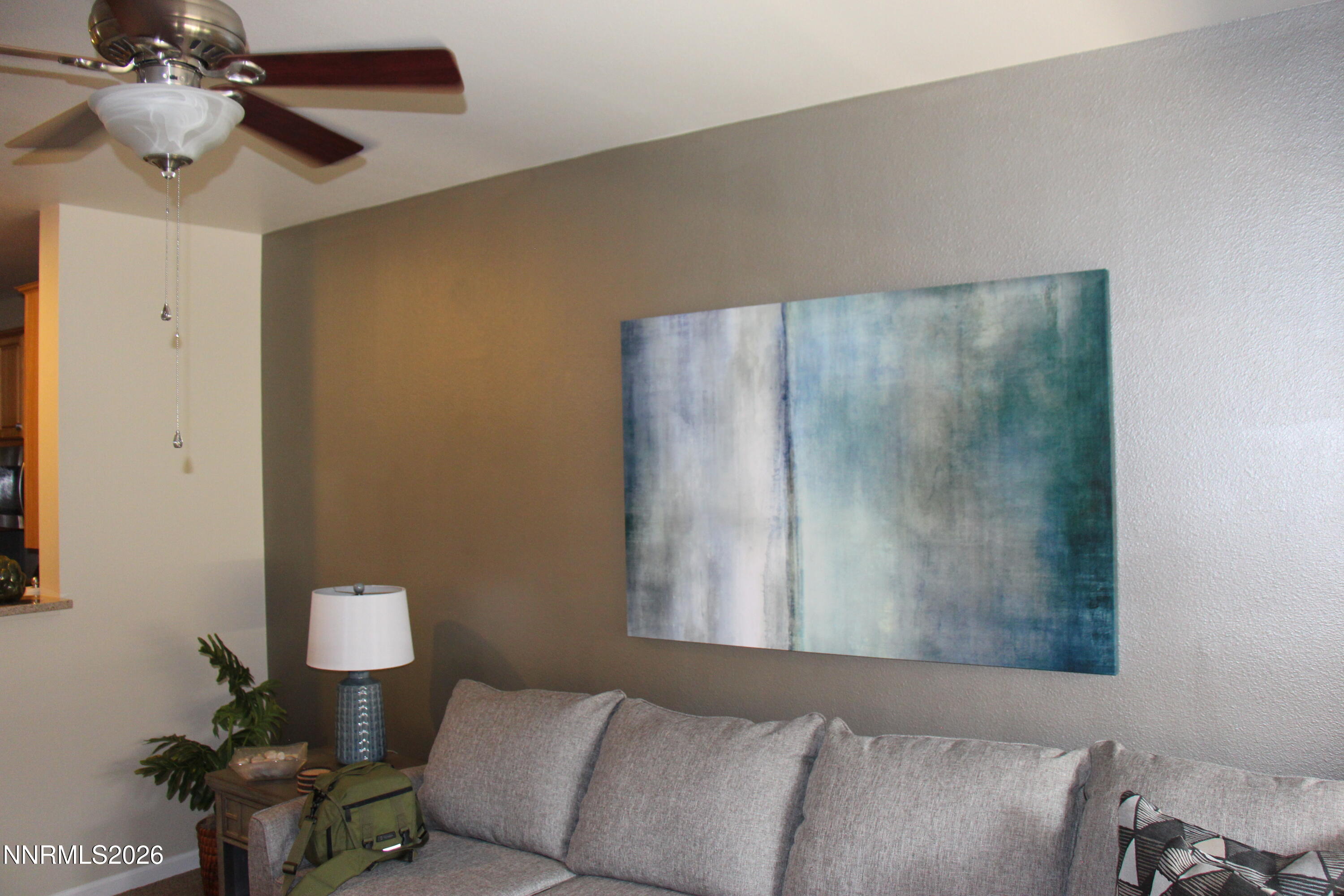 900 South Meadows Parkway, Unit 2122 Reno, NV 89521 - Photo 5 of 6 a bedroom with a bed and a chandelier fan