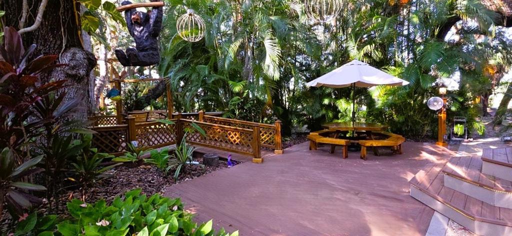 a view of outdoor space pool stove and chairs