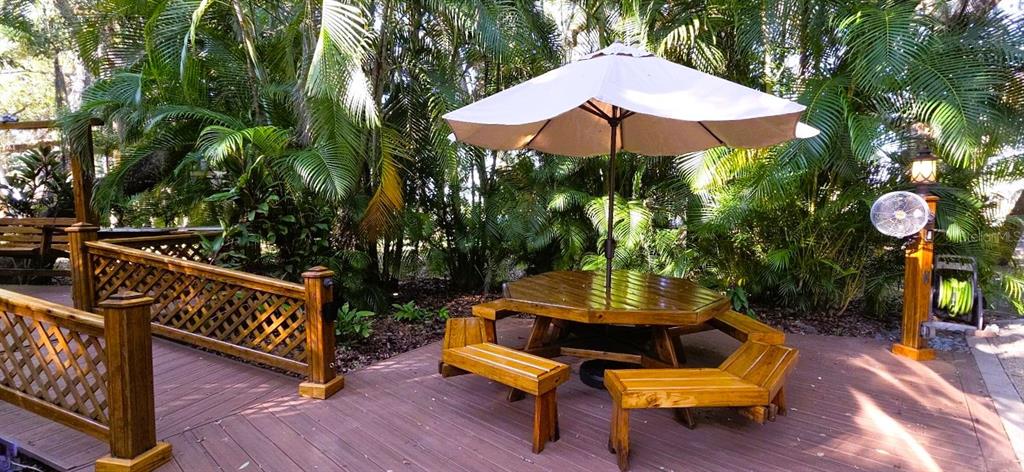 295 Bear Trail River Ranch, FL 33867 - Photo 5 of 16 an outdoor sitting area with chairs and wooden fence