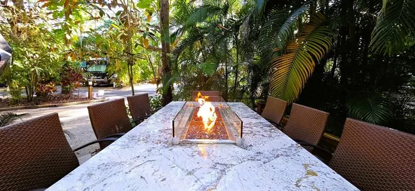 swimming pool view with a seating space