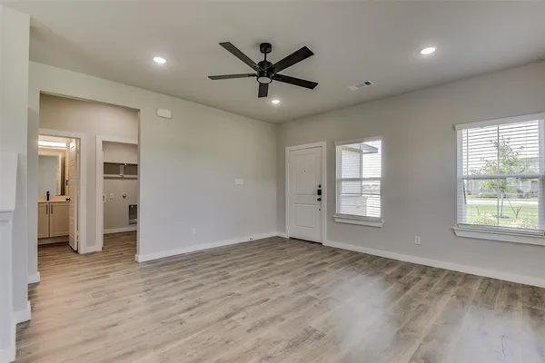 a view of an empty room with a window