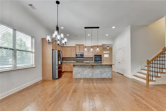 a view of an empty room with exposed radiator and fireplace