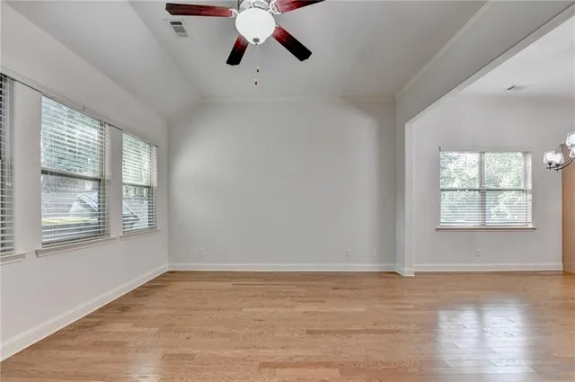 a bathroom with a sink mirror and toilet