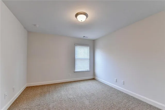a view of a patio with wooden floor