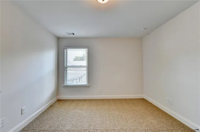 a view of porch with a small yard