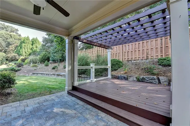 an aerial view of a house with garden space and street view
